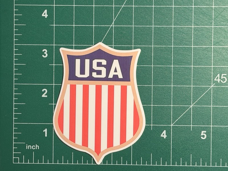 Team USA Hockey Shield/Crest – Laminated Vinyl Sticker – 3″x2.5″ USA GOLD MEDAL